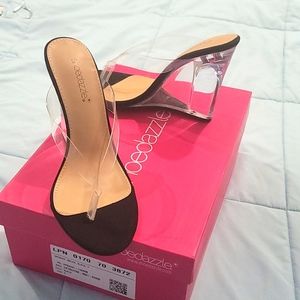 Brand new black wedge heels.  Never never woren.